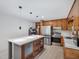 Modern kitchen featuring an island with quartz countertop, stainless appliances at 3806 Sue Ln, Raleigh, NC 27604