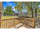 View from the home's back deck looking out onto the lawn and car port at 419 Joy Dr, Garner, NC 27529