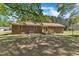 Spacious backyard featuring a wooden deck and a well-maintained lawn at 419 Joy Dr, Garner, NC 27529