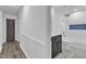 A bathroom features a black vanity, white marble flooring, and white subway tile in the shower at 419 Joy Dr, Garner, NC 27529