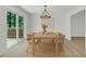 Charming dining area with a modern chandelier, stylish seating, and sliding door to the outside deck at 419 Joy Dr, Garner, NC 27529