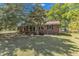 Charming brick home featuring a well-manicured lawn and mature trees at 419 Joy Dr, Garner, NC 27529