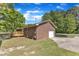 Exterior view of the home featuring a back deck and detached garage at 419 Joy Dr, Garner, NC 27529