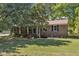 Beautiful brick home with a well-maintained lawn and mature trees at 419 Joy Dr, Garner, NC 27529
