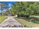 Spacious front yard with a long driveway and lush green grass at 419 Joy Dr, Garner, NC 27529