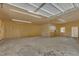 Spacious unfinished garage with concrete floor, wood framing, and fluorescent lighting at 419 Joy Dr, Garner, NC 27529