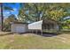Combination car port and detached garage on a property with mature trees at 419 Joy Dr, Garner, NC 27529