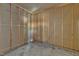 Unfinished portion of garage featuring concrete floor and wood framing at 419 Joy Dr, Garner, NC 27529