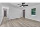 Bright open living room with wood-look flooring and freshly painted walls at 419 Joy Dr, Garner, NC 27529
