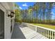 View of the deck overlooking large backyard, with mature trees at 4500 Governor Hunt St, Efland, NC 27243