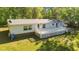 The backyard offers a spacious deck, ideal for outdoor gatherings and relaxation on sunny days at 4500 Governor Hunt St, Efland, NC 27243