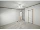 Carpeted bedroom with a ceiling fan and an open doorway at 4500 Governor Hunt St, Efland, NC 27243