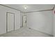 Carpeted bedroom with a door and an open entryway at 4500 Governor Hunt St, Efland, NC 27243