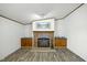 Living room featuring a stone fireplace flanked by built-in cabinets at 4500 Governor Hunt St, Efland, NC 27243