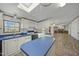 Spacious kitchen featuring a blue countertop, skylight, and adjacent spaces, perfect for cooking and entertaining at 4500 Governor Hunt St, Efland, NC 27243