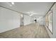 Open-concept living space featuring wood-look flooring and a bright interior at 4500 Governor Hunt St, Efland, NC 27243