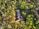 Birds eye view of a property showing the residence, outbuildings and surrounding trees at 452 Dogwood Trl, Henderson, NC 27537