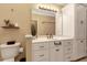 Bright bathroom with white cabinetry, vanity, and plentiful storage space at 452 Dogwood Trl, Henderson, NC 27537