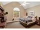 Bedroom with a vaulted ceiling, carpet floors, and a window with a view at 452 Dogwood Trl, Henderson, NC 27537