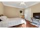 Bedroom with a large window, hardwood floors, and neutral paint at 452 Dogwood Trl, Henderson, NC 27537