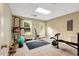 Bright exercise room features large windows, tile flooring and ample space for workout equipment at 452 Dogwood Trl, Henderson, NC 27537