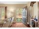 Open foyer welcomes you with hardwood floors and natural light flowing through the doorway at 452 Dogwood Trl, Henderson, NC 27537