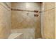 Tile shower with a built-in bench and shelving, featuring a glass door at 452 Dogwood Trl, Henderson, NC 27537
