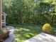 Large, green backyard featuring a well-kept lawn and surrounding trees at 5016 Dillswood Ln, Raleigh, NC 27606