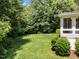 Lush backyard featuring mature trees and a well manicured lawn with great outdoor space at 5016 Dillswood Ln, Raleigh, NC 27606