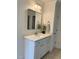 Bathroom showcasing a white vanity, granite countertop, and a framed mirror at 5016 Dillswood Ln, Raleigh, NC 27606