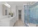 Bathroom with walk-in shower, dual vanity, and walk-in closet at 5016 Dillswood Ln, Raleigh, NC 27606