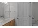 Bathroom featuring a sink vanity and a toilet, with clean lines and neutral tones at 5016 Dillswood Ln, Raleigh, NC 27606