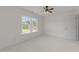 Bright, carpeted bedroom with windows overlooking lush landscaping at 5016 Dillswood Ln, Raleigh, NC 27606