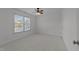 Neutral bedroom features carpet, white walls, and large window at 5016 Dillswood Ln, Raleigh, NC 27606