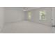 Large primary bedroom featuring neutral colors and natural light at 5016 Dillswood Ln, Raleigh, NC 27606