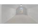 Spacious bonus room featuring an arched window that fills the room with natural light at 5016 Dillswood Ln, Raleigh, NC 27606