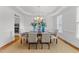 Dining room with a large table set for a meal, complemented by stylish decor at 5016 Dillswood Ln, Raleigh, NC 27606