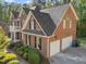 Red brick home with black shutters and a two-car attached garage at 5016 Dillswood Ln, Raleigh, NC 27606