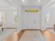 Bright and welcoming foyer featuring hardwood floors and classic architectural details at 5016 Dillswood Ln, Raleigh, NC 27606