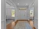 Bright entryway with hardwood floors and views to the dining and living room at 5016 Dillswood Ln, Raleigh, NC 27606