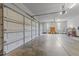 Spacious three car garage featuring bright lighting and ample room for vehicles and storage at 5016 Dillswood Ln, Raleigh, NC 27606