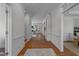 Spacious hallway with hardwood floors that leads to a comfortable living area at 5016 Dillswood Ln, Raleigh, NC 27606