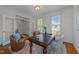 Well-lit home office with hardwood floors and glass paneled french doors at 5016 Dillswood Ln, Raleigh, NC 27606