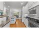Modern kitchen with stainless steel appliances, granite countertops, and an island at 5016 Dillswood Ln, Raleigh, NC 27606