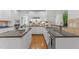 Spacious kitchen with granite countertops, tile backsplash, and stainless steel sink at 5016 Dillswood Ln, Raleigh, NC 27606