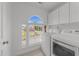 Bright laundry room with natural light, includes updated washer and dryer units at 5016 Dillswood Ln, Raleigh, NC 27606