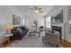 Inviting living room with a decorative fireplace, ceiling fan, modern furnishings, and elegant decor at 5016 Dillswood Ln, Raleigh, NC 27606