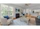Bright and airy living room featuring a fireplace and lots of natural light at 5016 Dillswood Ln, Raleigh, NC 27606