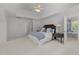 Spacious bedroom features vaulted ceilings, ceiling fan, and access to the bathroom at 5016 Dillswood Ln, Raleigh, NC 27606