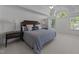 Large main bedroom featuring a tray ceiling, lots of natural light and neutral decor at 5016 Dillswood Ln, Raleigh, NC 27606